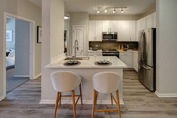 Kitchen Designed With Ample Storage Space at The MilTon Luxury Apartments, Illinois